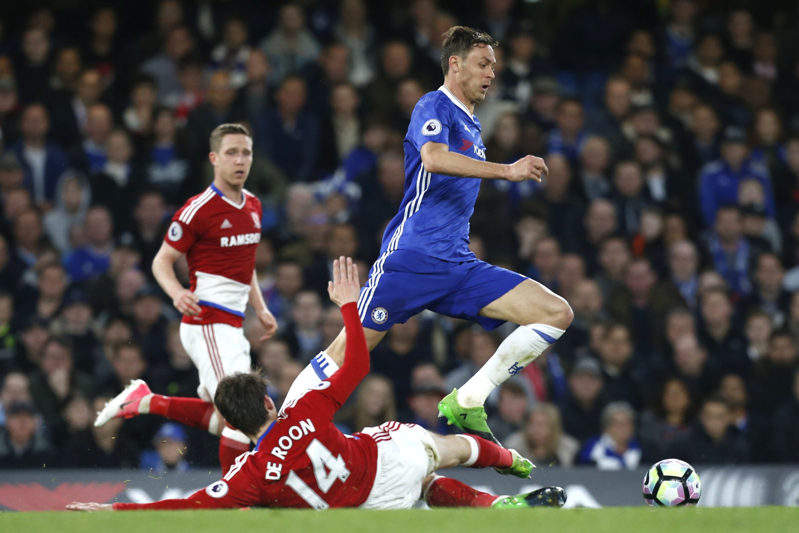 Chelsea's Serbian midfielder Nemanja Matic (R) skips a tackle by Middlesbrough's Dutch midfielder Marten de Roon during the English Premier League football match between Chelsea and Middlesbrough at Stamford Bridge in London on May 8, 2017. / AFP PHOTO / 