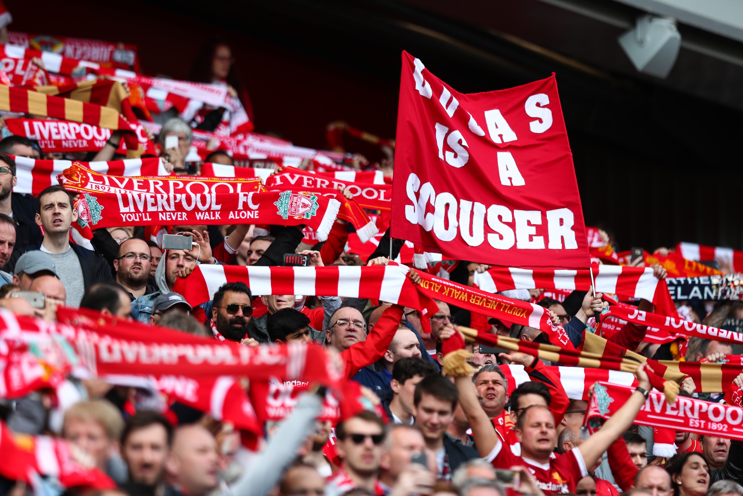 LIVERPOOL, ENGLAND - MAY 21: Liverpool fans hold up scarves and a sign saying Lucas is a scouser during the Premier League match between Liverpool and Middlesbrough at Anfield on May 21, 2017 in Liverpool, England. (Photo by Robbie Jay Barratt - AMA/Getty