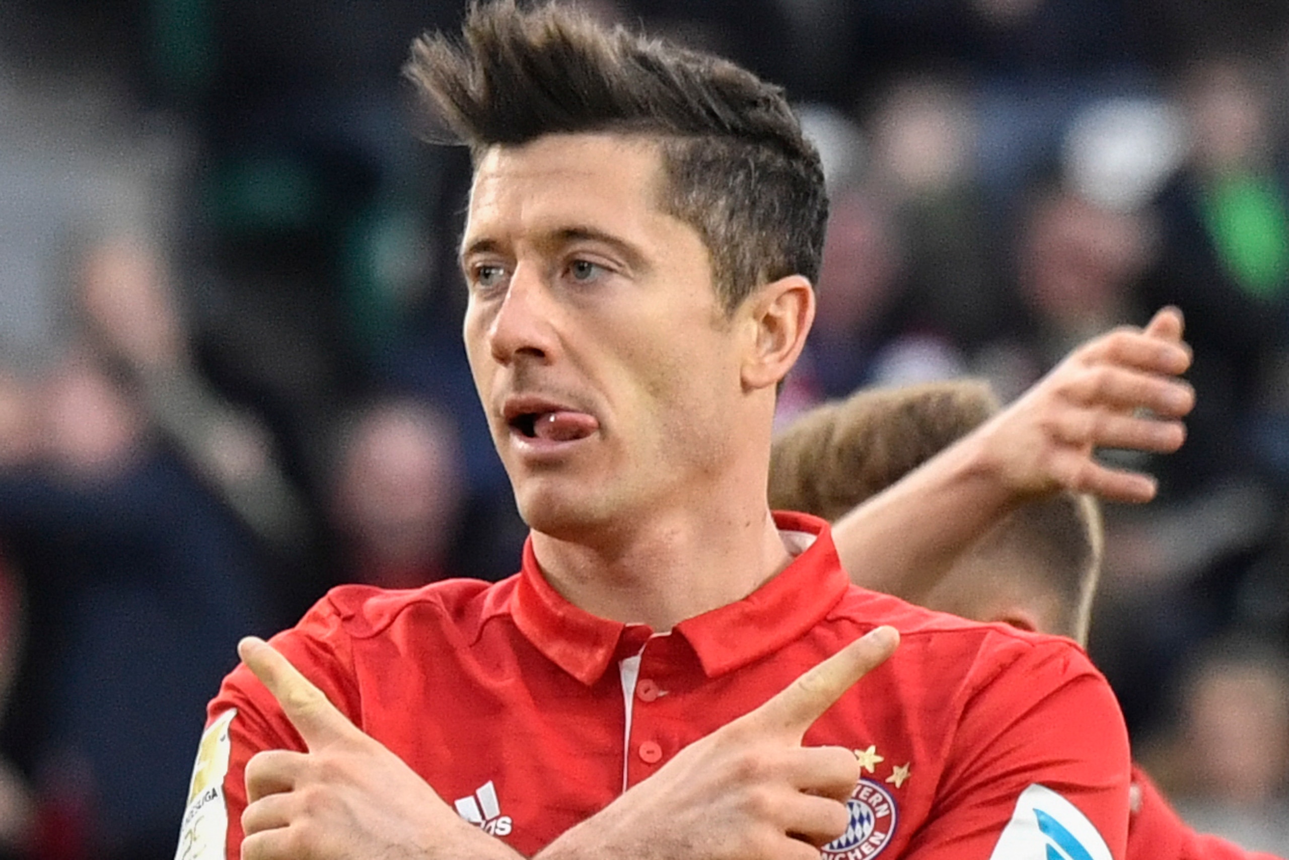 Bayern Munich's Polish forward Robert Lewandowski celebrates after scoring during the German first division Bundesliga football match between VfL Wolfsburg and Bayern Munich on April 29, 2017 in Wolfsburg, northern Germany. / AFP PHOTO / John MACDOUGALL / Bayern Munich's Polish forward Robert Lewandowski celebrates after scoring during the German first division Bundesliga football match between VfL Wolfsburg and Bayern Munich on April 29, 2017 in Wolfsburg, northern Germany. / AFP PHOTO / John MACDOUGALL /