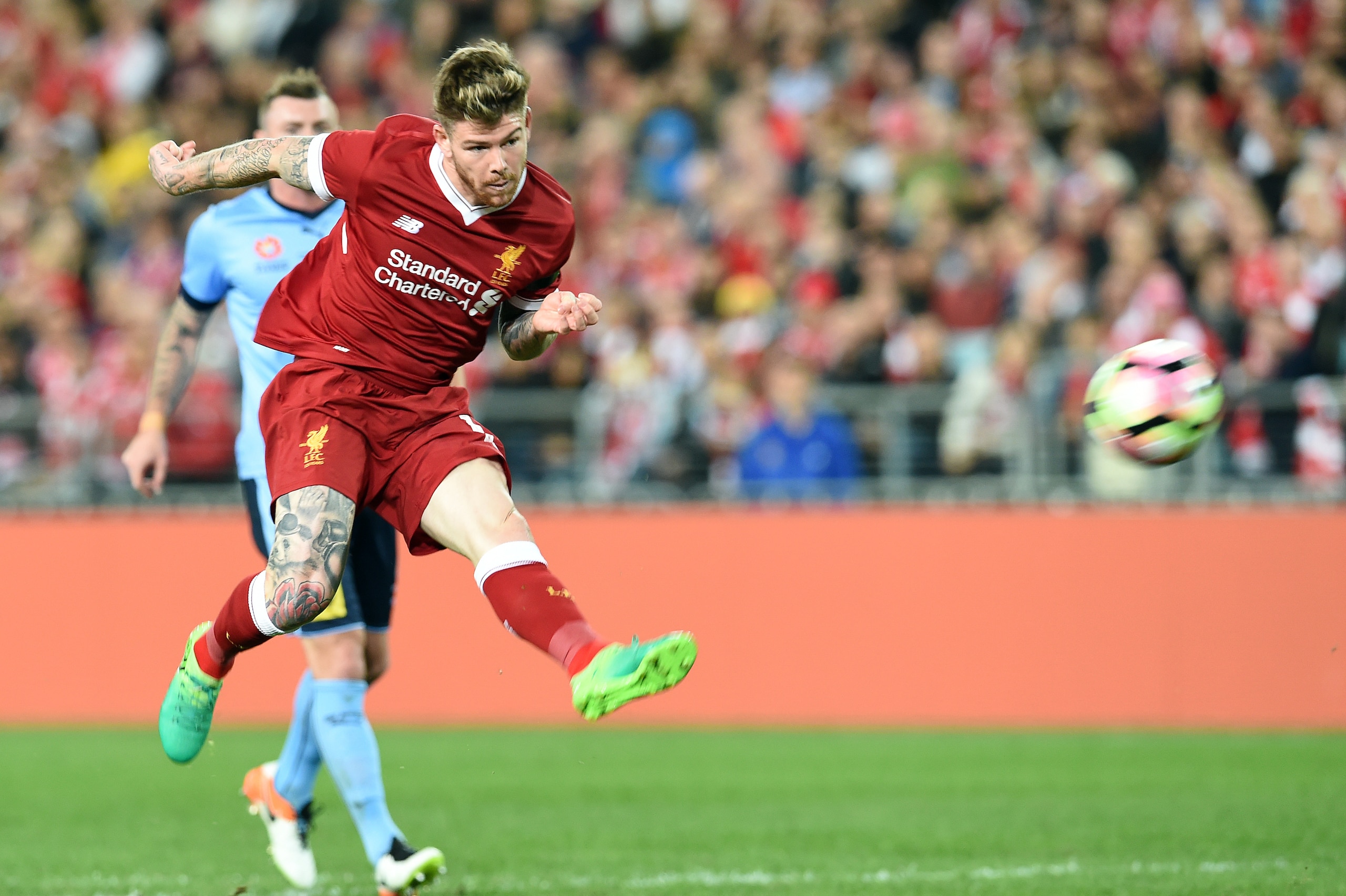 Liverpool's Alberto Moreno scores a goal against Sydney FC during their end-of-season friendly football match at the Olympic Stadium in Sydney on May 24, 2017. / AFP PHOTO / SAEED KHAN / IMAGE RESTRICTED TO EDITORIAL USE - STRICTLY NO COMMERCIAL USE      