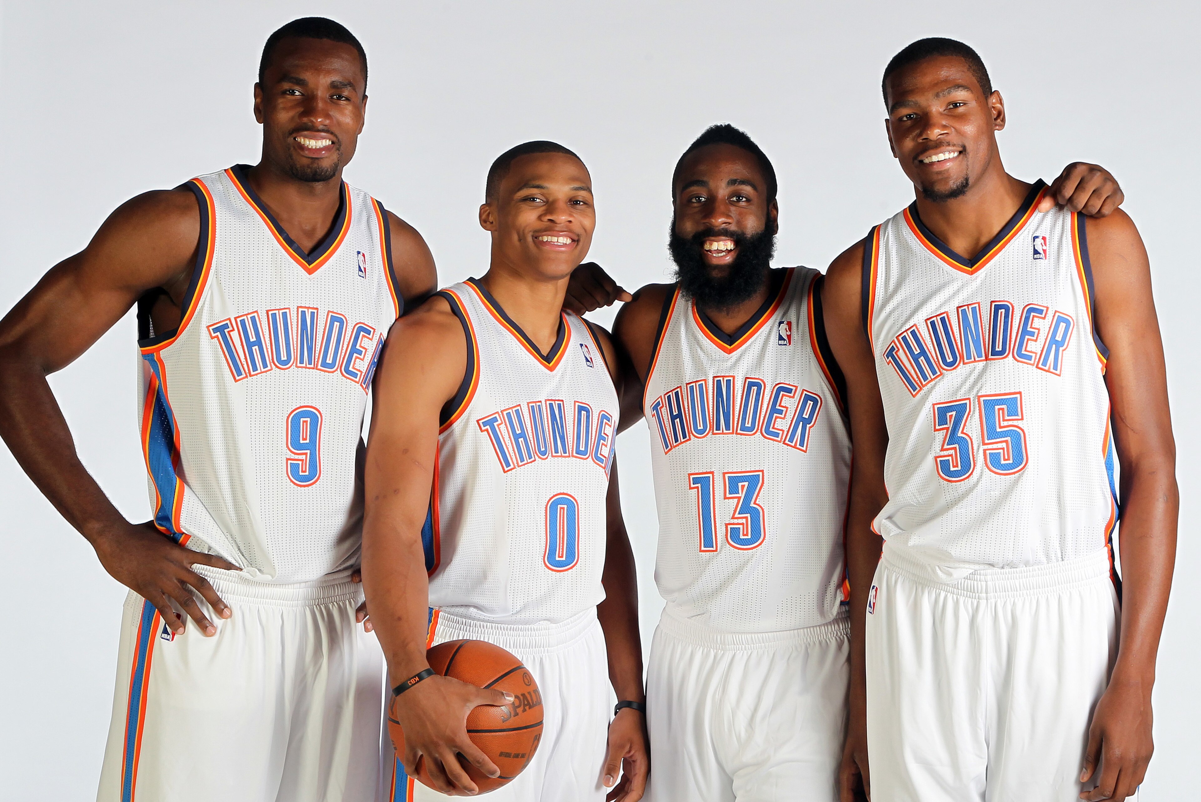 EDMOND, OK - OCTOBER 1: Serge Ibaka #9, Russell Westbrook #0, James Harden #13 and Kevin Durant of the Oklahoma City Thunder pose for a portrait during 2012 NBA Media Day on October 1, 2012 at the Thunder Events Center in Edmond, Oklahoma. NOTE TO USER: U EDMOND, OK - OCTOBER 1: Serge Ibaka #9, Russell Westbrook #0, James Harden #13 and Kevin Durant of the Oklahoma City Thunder pose for a portrait during 2012 NBA Media Day on October 1, 2012 at the Thunder Events Center in Edmond, Oklahoma. NOTE TO USER: U