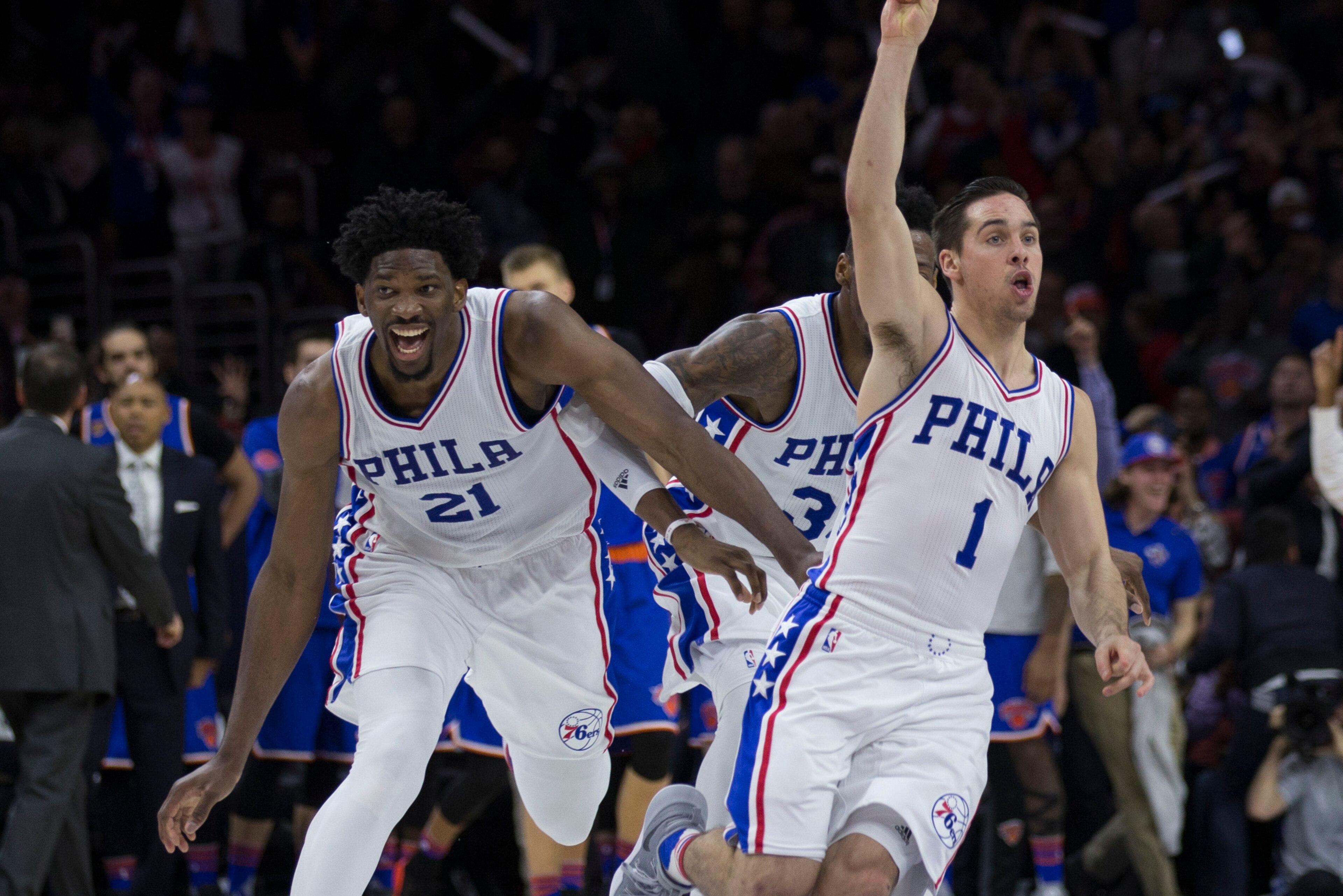 PHILADELPHIA, PA - JANUARY 11: T.J. McConnell #1 of the Philadelphia 76ers celebrates with Joel Embiid #21 and Robert Covington #33 after making the game winning shot at the buzzer against the New York Knicks at the Wells Fargo Center on January 11, 2017 PHILADELPHIA, PA - JANUARY 11: T.J. McConnell #1 of the Philadelphia 76ers celebrates with Joel Embiid #21 and Robert Covington #33 after making the game winning shot at the buzzer against the New York Knicks at the Wells Fargo Center on January 11, 2017