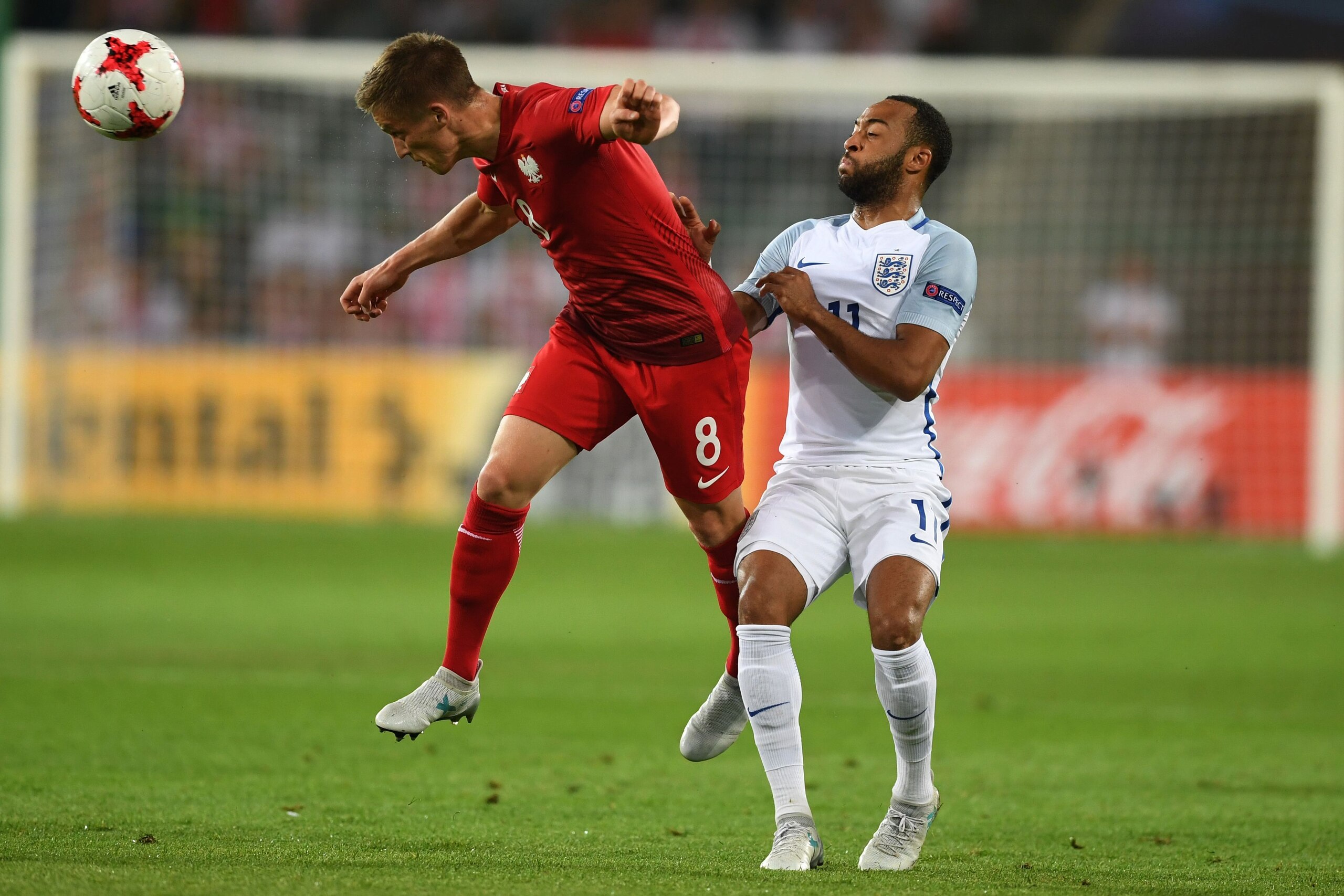 Poland's midfielder Radoslaw Murawski (L) and England's midfielder Nathan Redmond vie for the ball during the UEFA U-21 European Championship Group A football match England v Poland in Kielce, Poland on June 22, 2017. / AFP PHOTO / PIOTR NOWAK        (Pho