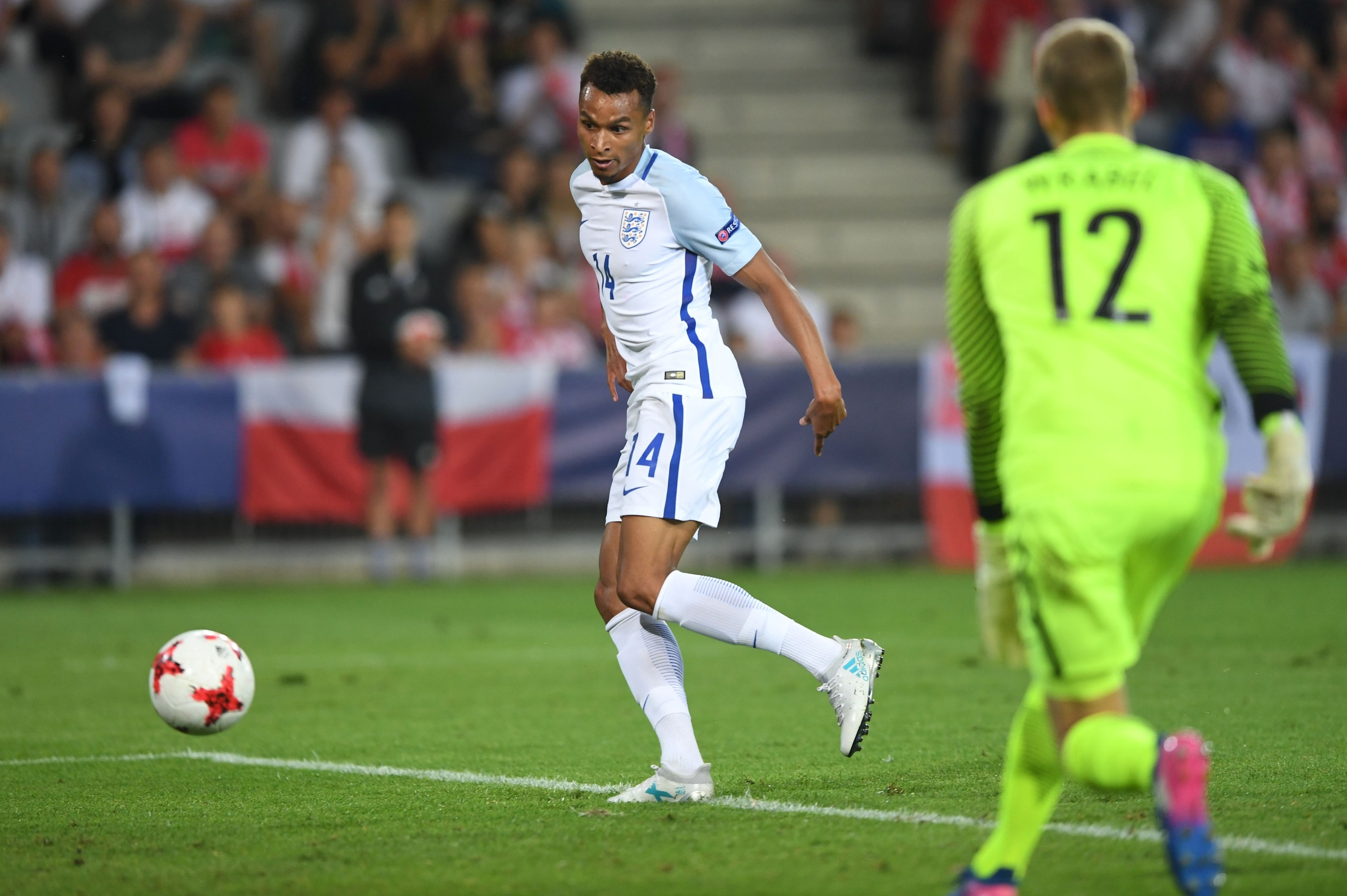 England's midfielder Jacob Murphy (L) scores past Poland's goalkeeper Jakub Wrabel during the UEFA U-21 European Championship Group A football match England v Poland in Kielce, Poland on June 22, 2017. / AFP PHOTO / PIOTR NOWAK        (Photo credit should