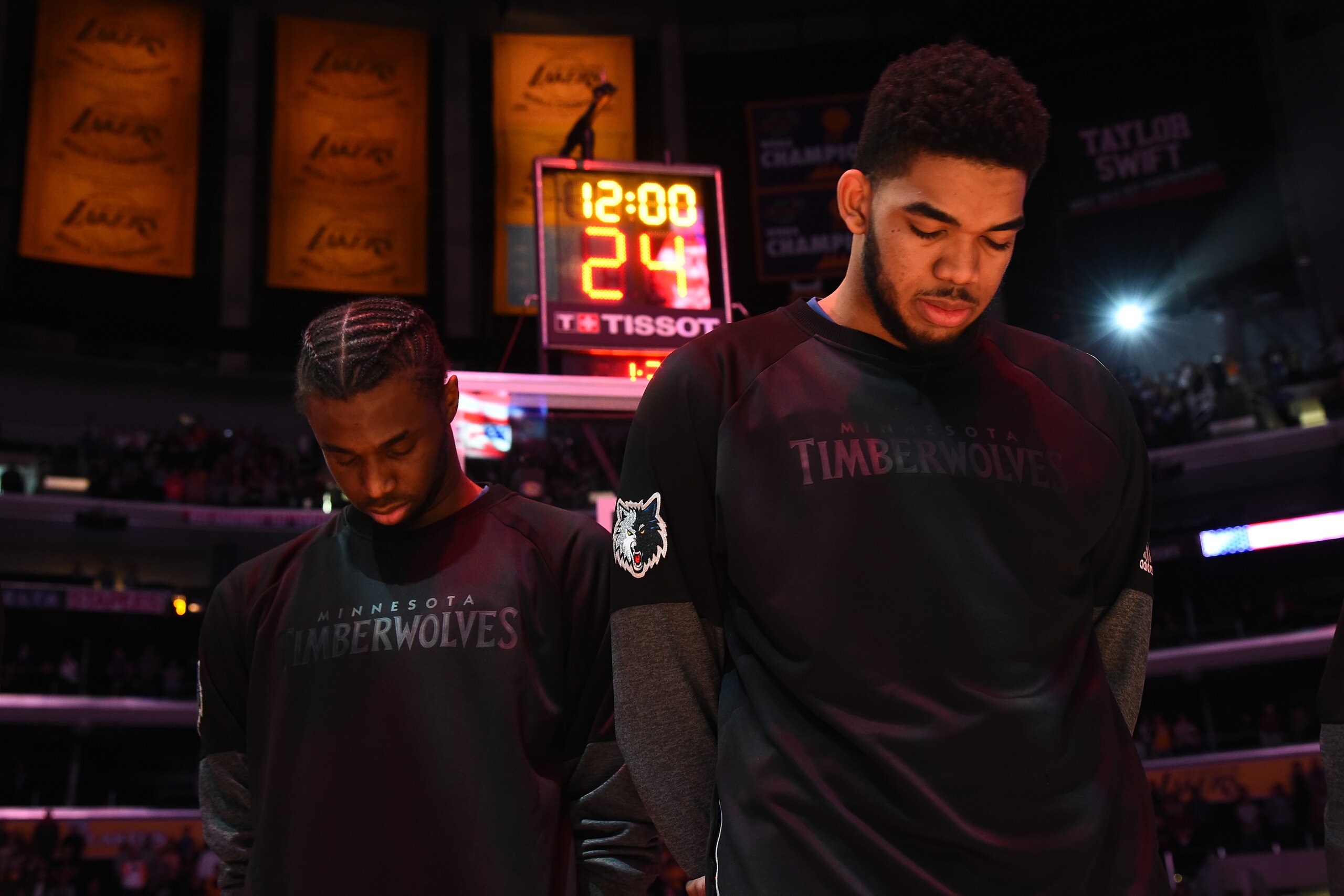 LOS ANGELES, CA - APRIL 9: Andrew Wiggins #22 and Karl-Anthony Towns #32 of the Minnesota Timberwolves stand for the National Anthem before the game against the Los Angeles Lakers on April 9, 2017 at STAPLES Center in Los Angeles, California. NOTE TO USER