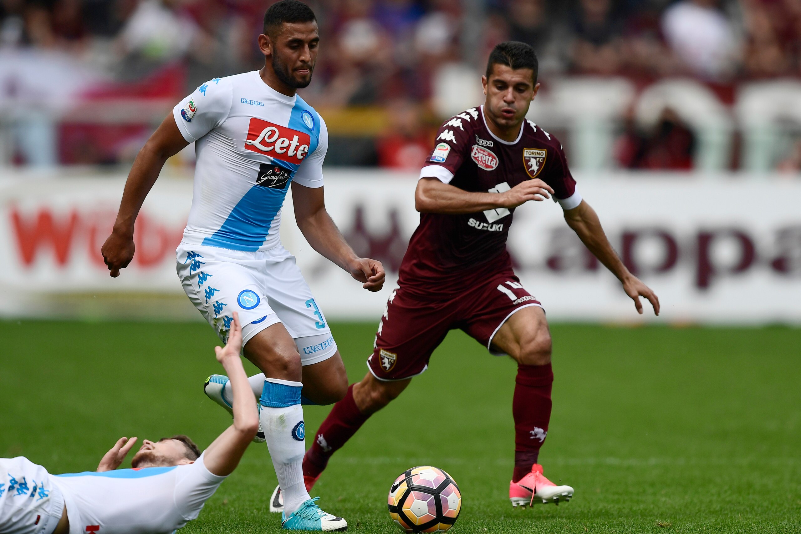 Napoli's French defender Faouzi Ghoulam vies with Torino's Spanish forward Iago Falque (R) during the Italian Serie A football match Torino vs Napoli at the Olympic stadium in Turin, on May 14, 2017. / AFP PHOTO / MIGUEL MEDINA (Photo credit should Napoli's French defender Faouzi Ghoulam vies with Torino's Spanish forward Iago Falque (R) during the Italian Serie A football match Torino vs Napoli at the Olympic stadium in Turin, on May 14, 2017. / AFP PHOTO / MIGUEL MEDINA (Photo credit should