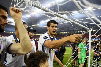 CARDIFF, WALES - JUNE 03:  Alvaro Morata of Real Madrid cuts the net after the UEFA Champions League Final between Juventus and Real Madrid at National Stadium of Wales on June 3, 2017 in Cardiff, Wales.  (Photo by Shaun Botterill/Getty Images)