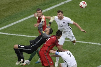 (From L) Portugal's defender Pepe, Portugal's goalkeeper Rui Patricio and Portugal's defender Bruno Alves vie with New Zealand's defender Tommy Smith (R) and New Zealand's forward Chris Wood during the 2017 Confederations Cup group A football match betwee