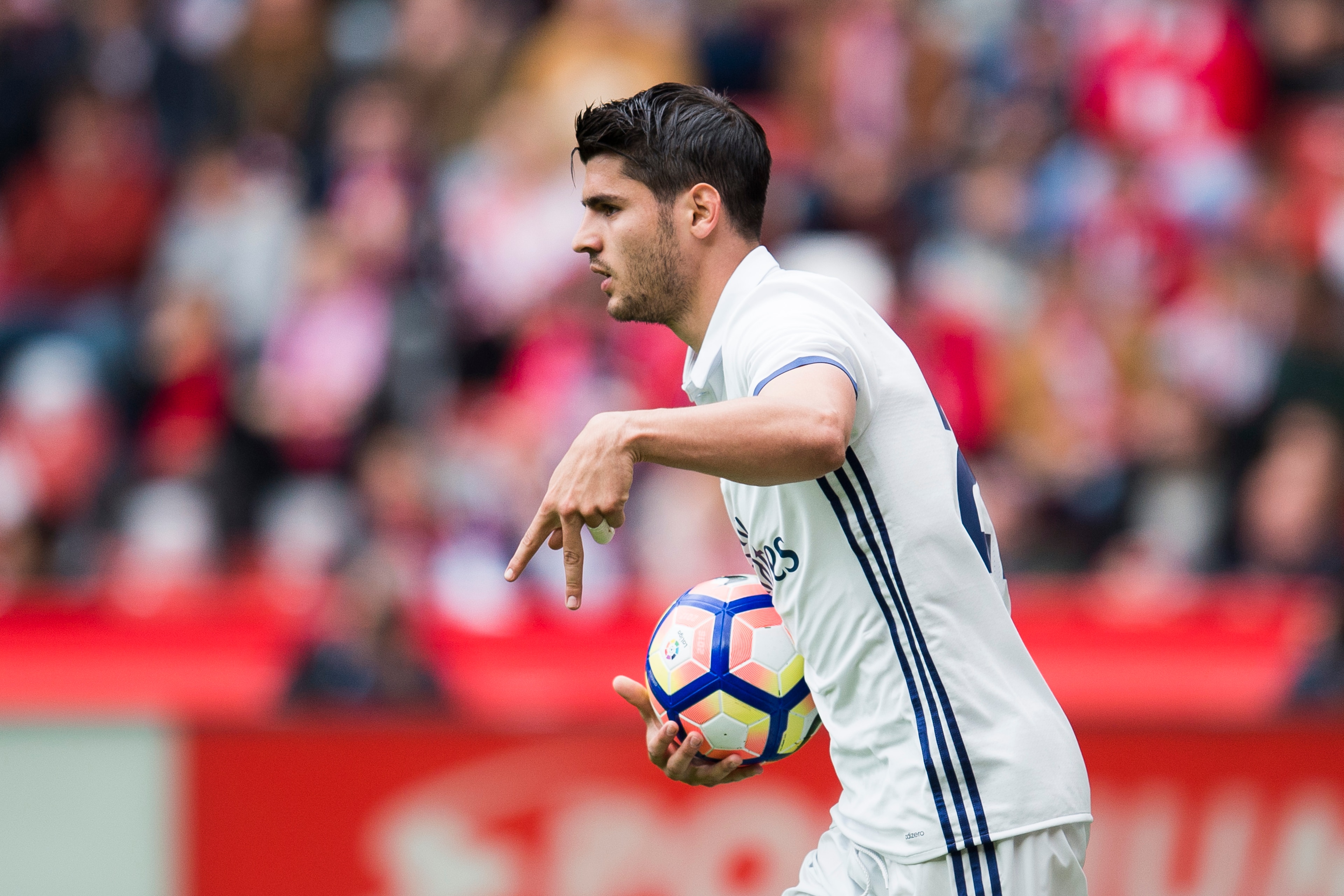GIJON, SPAIN - APRIL 15:  Alvaro Morata of Real Madrid celebrates after scoring his team's second goal during the La Liga match between Real Sporting de Gijon and Real Madrid at Estadio El Molinon on April 15, 2017 in Gijon, Spain.  (Photo by Juan Manuel 