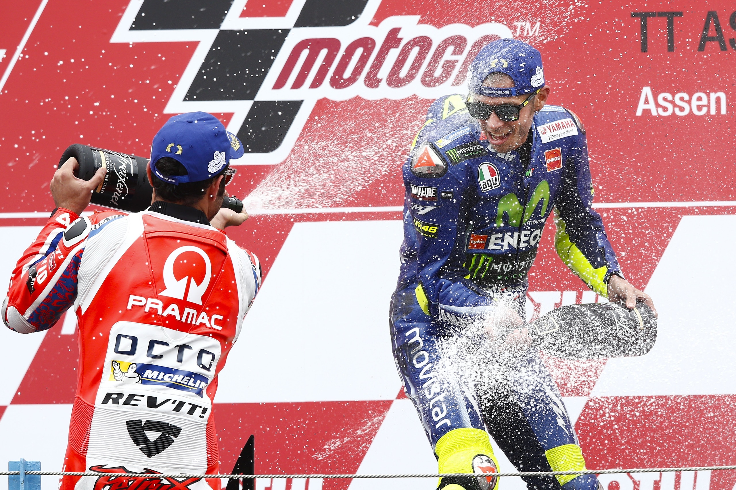 Italy's Valentino Rossi celebrates winning the MotoGP race of the Motorcycling Grand Prix of Assen at the TT circuit in Assen on June 25, 2017.  / AFP PHOTO / ANP / Vincent JANNINK / Netherlands OUT        (Photo credit should read VINCENT JANNINK/AFP/Get
