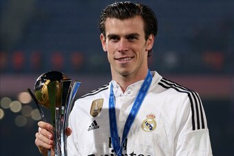 MARRAKECH, MOROCCO - DECEMBER 20: Gareth Bale of Real Madrid poses with the trophy following the FIFA Club World Cup Final match between Real Madrid CF and San Lorenzo at Marrakech Stadium on December 20, 2014 in Marrakech, Morocco. (Photo by Chris Brunsk
