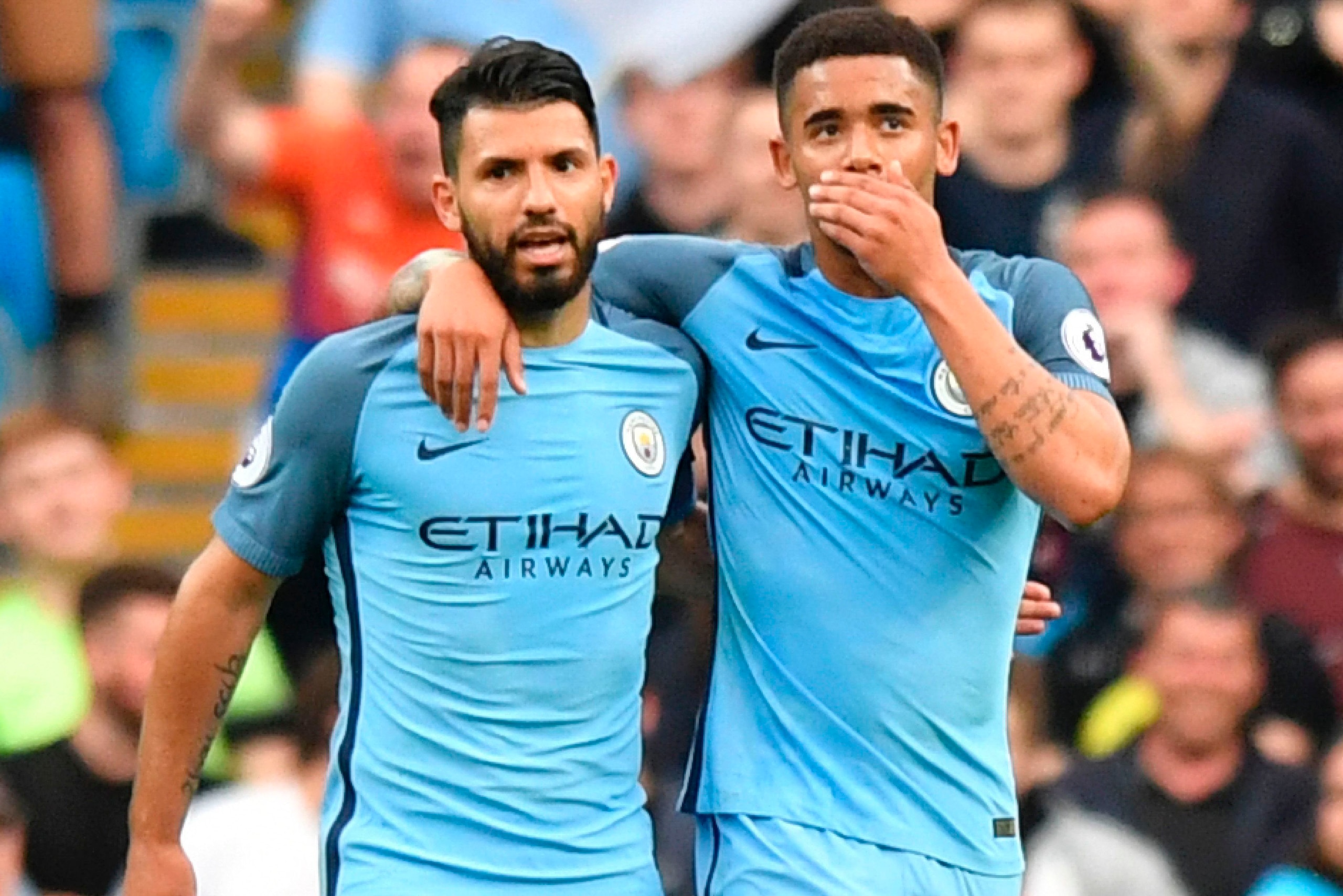 Manchester City's Brazilian striker Gabriel Jesus (R) walks with Manchester City's Argentinian striker Sergio Aguero (L) as he celebrates scoring the opening goal during the English Premier League football match between Manchester City and West Bromwich A