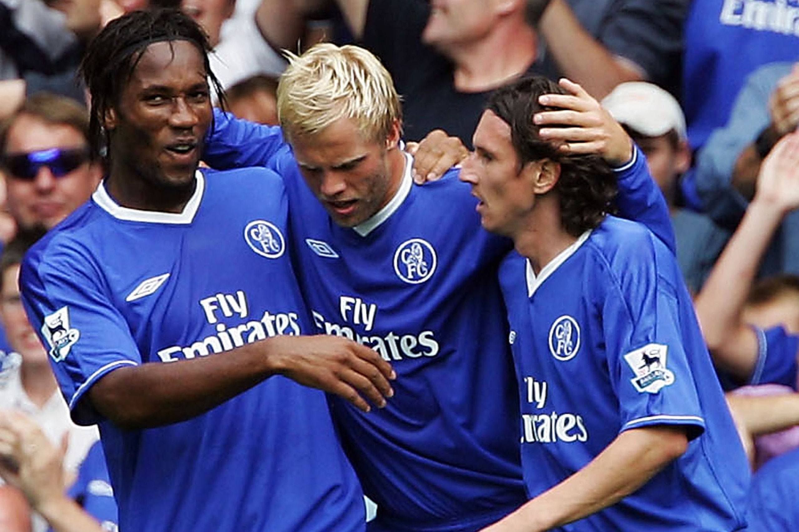 LONDON - AUGUST 15:  Eidur Gudjohnsen of Chelsea is congratulated by Alexei Smertin (R) and Didier Drogba after he scored their first goal during the Barclays Premiership match between Chelsea and Manchester United at Stamford Bridge on August 15, 2004 in