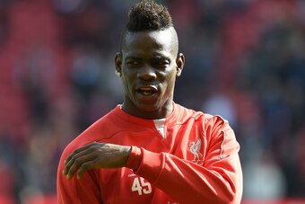 Liverpool's Italian striker Mario Balotelli warms up ahead of the English Premier League football match between Liverpool and Manchester United at Anfield in Liverpool, north west England on March 22, 2015. AFP PHOTO / PAUL ELLIS

RESTRICTED TO EDITORIAL 