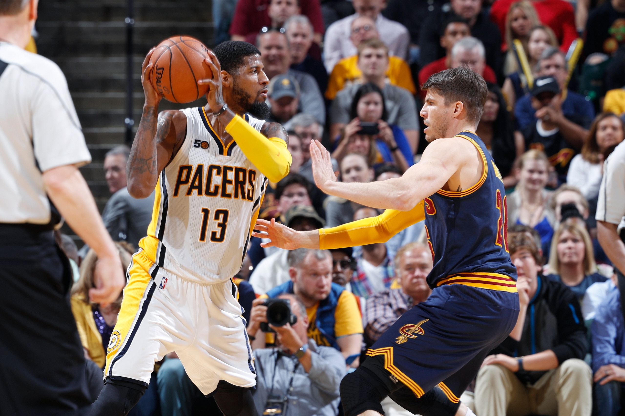 INDIANAPOLIS, IN - APRIL 23: Paul George #13 of the Indiana Pacers handles the ball while defended by Kyle Korver #26 of the Cleveland Cavaliers in Game Four of the Eastern Conference Quarterfinals during the 2017 NBA Playoffs at Bankers Life Fieldhouse o INDIANAPOLIS, IN - APRIL 23: Paul George #13 of the Indiana Pacers handles the ball while defended by Kyle Korver #26 of the Cleveland Cavaliers in Game Four of the Eastern Conference Quarterfinals during the 2017 NBA Playoffs at Bankers Life Fieldhouse o