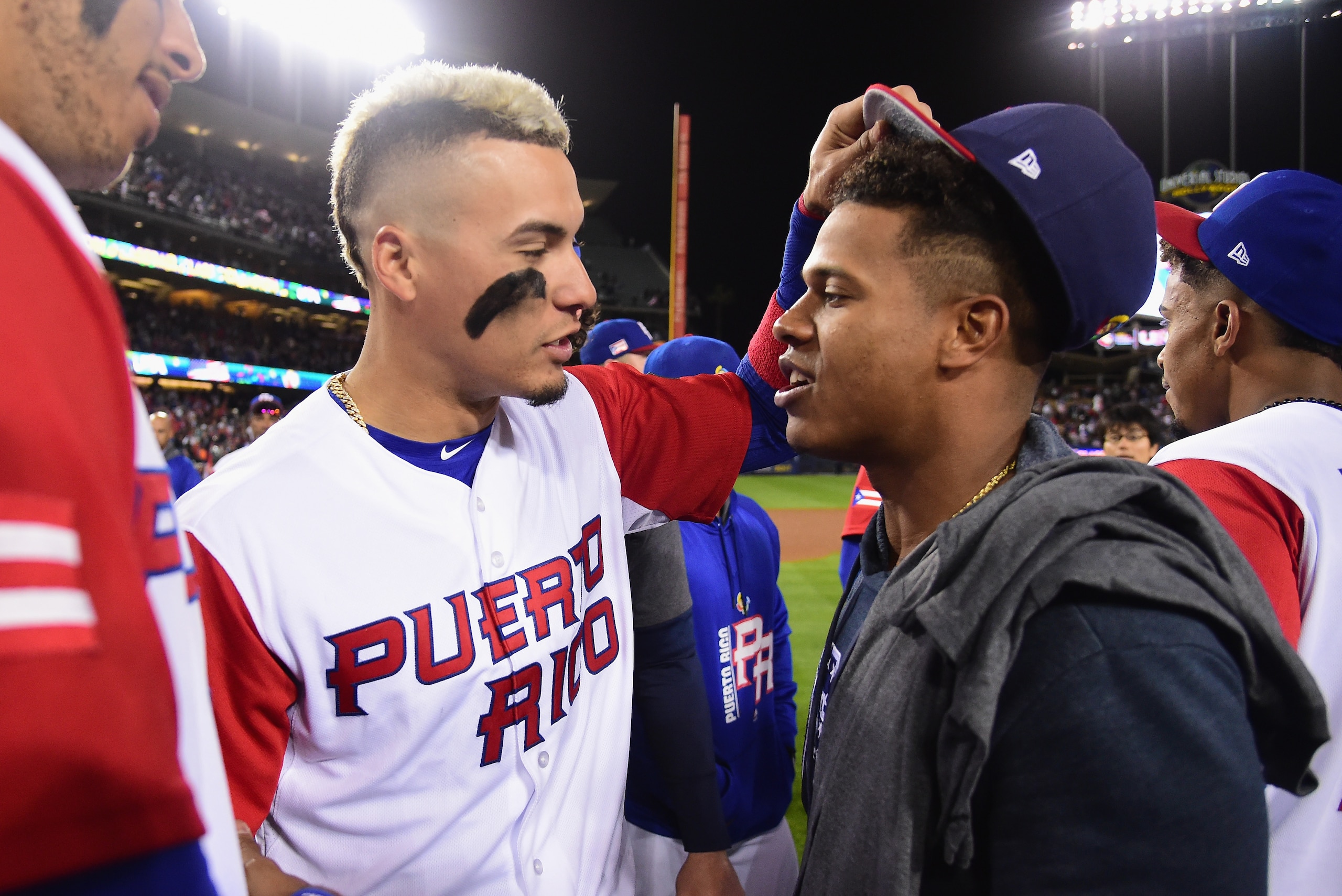 LOS ANGELES, CA - MARCH 22:  Javier Baez #9 of team Puerto Rico jokingly takes the hat off Marcus Stroman #6 of team United States after team USA's 8-0 win over Puerto Rico during Game 3 of the Championship Round of the 2017 World Baseball Classic at Dodg