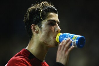 MANCHESTER - NOVEMBER 4:  Cristano Ronaldo of Manchester United takes a drink during the UEFA Champions League match between Manchester United and Rangers on November 4, 2003 at Old Trafford in Manchester, England.  Manchester United won the match 3-0.  (