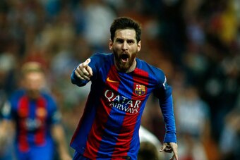 Barcelona's Argentinian forward Lionel Messi celebrates after scoring during the Spanish league Clasico football match Real Madrid CF vs FC Barcelona at the Santiago Bernabeu stadium in Madrid on April 23, 2017. / AFP PHOTO / OSCAR DEL POZO        (Photo 