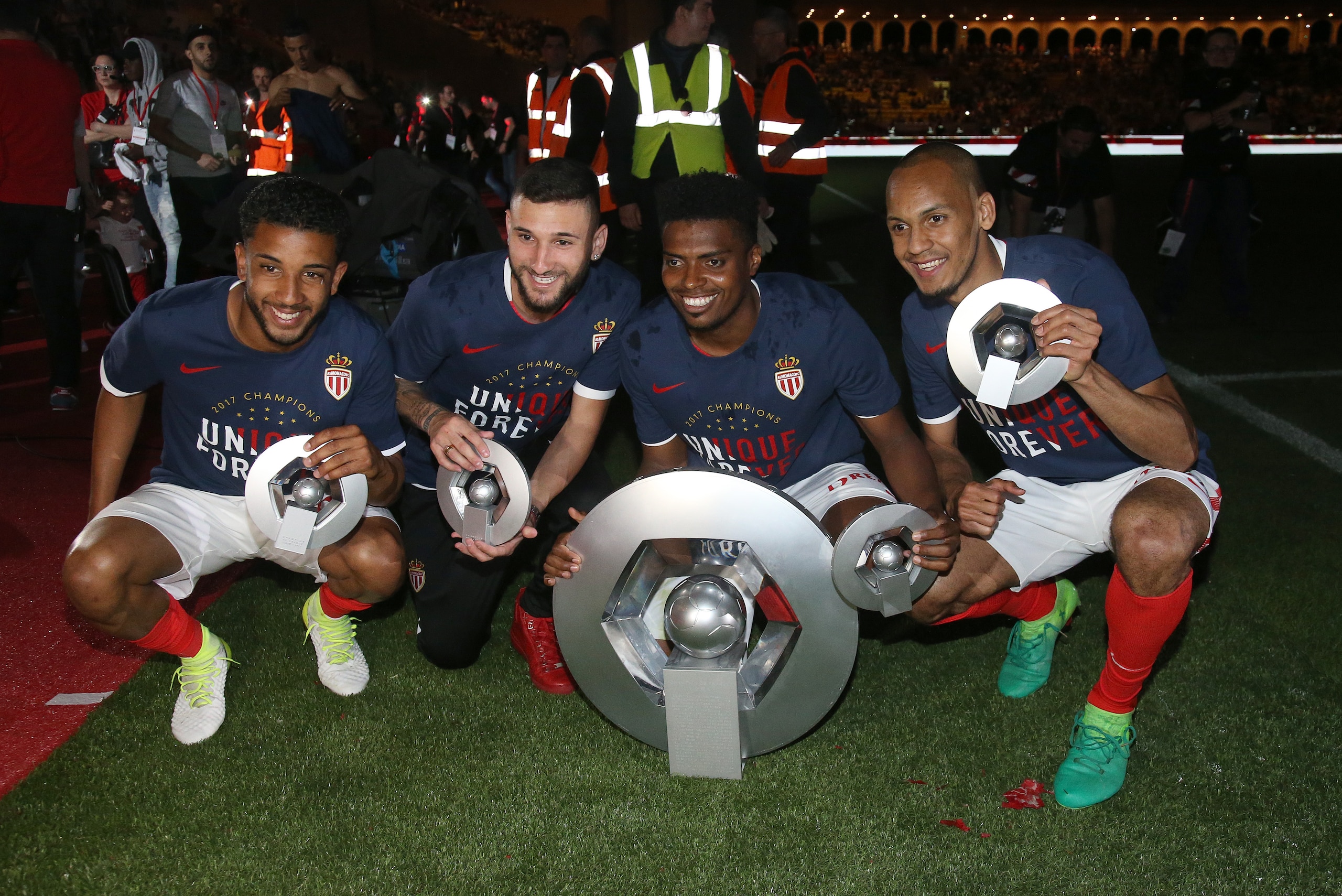MONACO, MONACO - MAY 17: Jorge Marco de Oliveira Moraes, Gabriel Boschilia,  Jemerson. Fabinho pose with the trophy of French League 1 champion following the French Ligue 1 match between AS Monaco and AS Saint-Etienne (ASSE) at Stade Louis II on May 17, 2