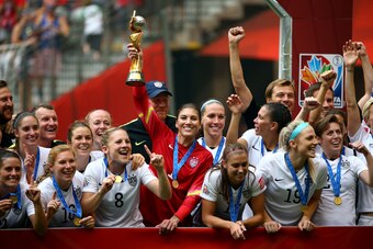 VANCOUVER, BC - JULY 05:  Goalkeeper Hope Solo #1 of the United States of America holds the World Cup Trophy after their 5-2 win over Japan in the FIFA Women's World Cup Canada 2015 Final at BC Place Stadium on July 5, 2015 in Vancouver, Canada.  (Photo b