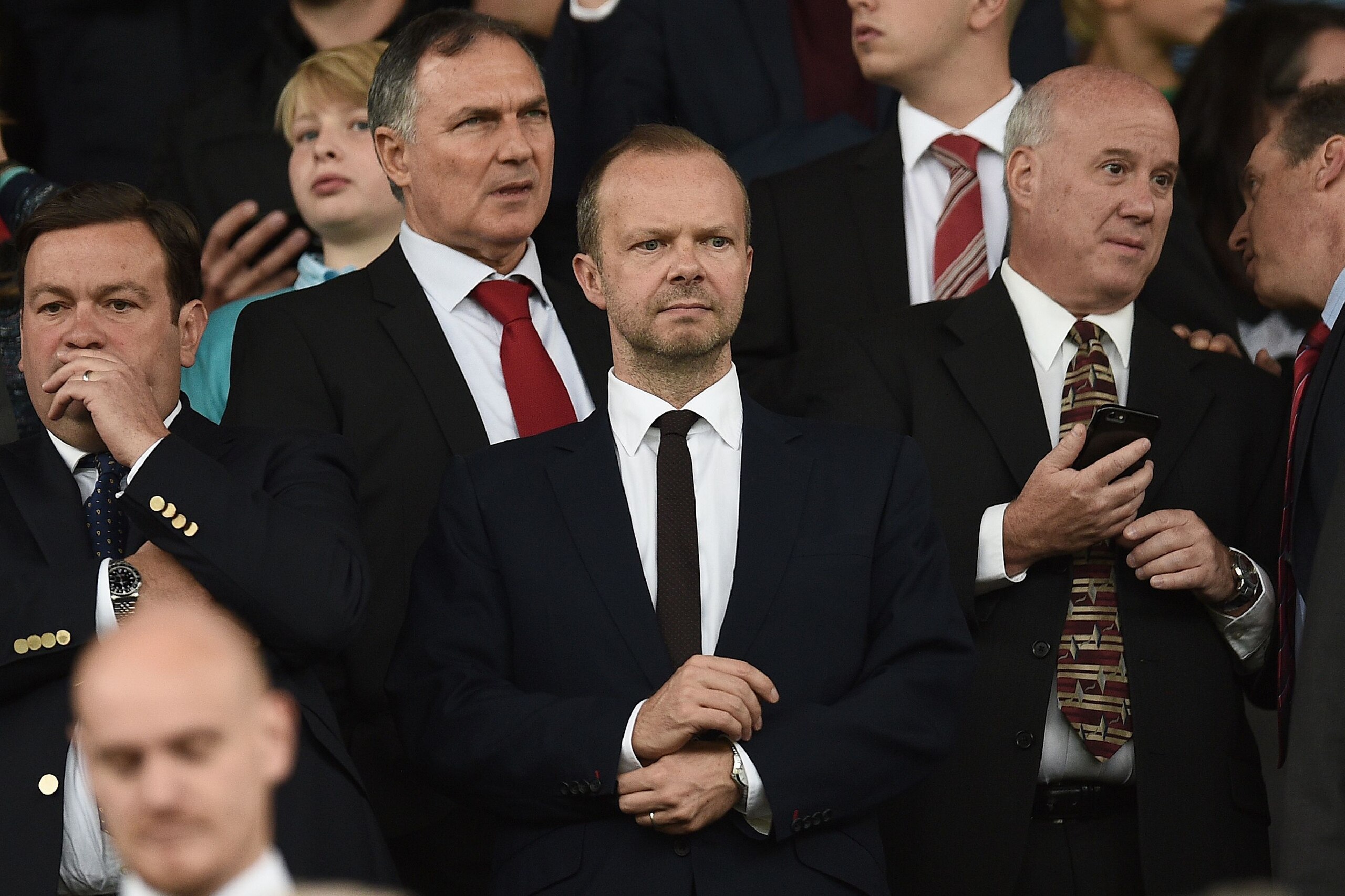 Manchester United's executive vice-chairman Ed Woodward (C) awaits kick-off in the English Premier League football match between Manchester United and Manchester City at Old Trafford in Manchester, north west England, on September 10, 2016.
Jose Mourinho'