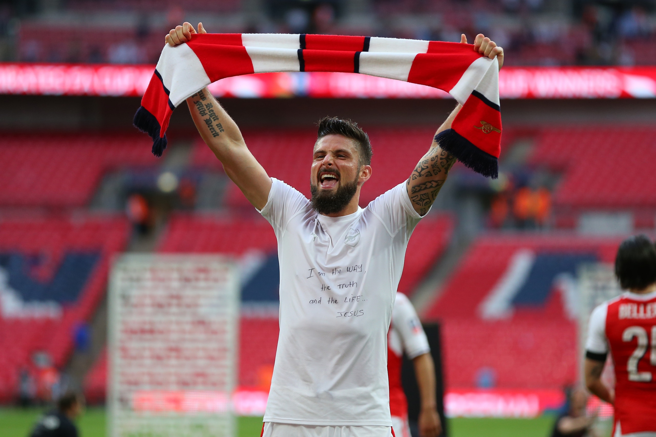LONDON, ENGLAND - MAY 27: Olivier Giroud of Arsenal with religious message on his shirt holds a scarf during the Emirates FA Cup Final match between Arsenal and Chelsea at Wembley Stadium on May 27, 2017 in London, England. (Photo by Catherine Ivill - AMA LONDON, ENGLAND - MAY 27: Olivier Giroud of Arsenal with religious message on his shirt holds a scarf during the Emirates FA Cup Final match between Arsenal and Chelsea at Wembley Stadium on May 27, 2017 in London, England. (Photo by Catherine Ivill - AMA