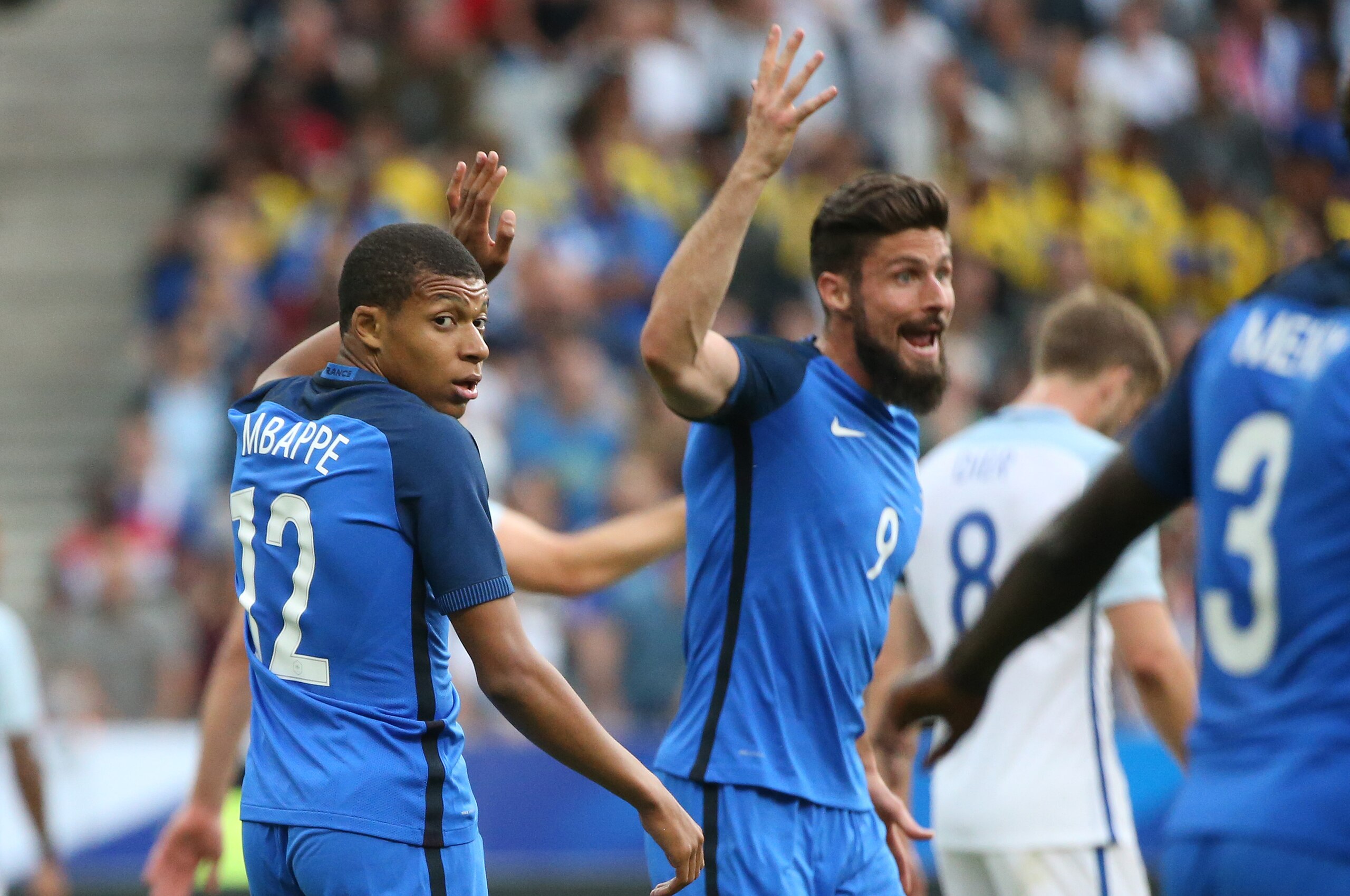 PARIS, FRANCE - JUNE 13: Kylian Mbappe and Olivier Giroud of France react during the international friendly match between France and England at Stade de France on June 13, 2017 in Saint-Denis near Paris, France. (Photo by Jean Catuffe/Getty Images)