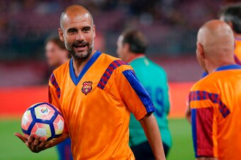 Former FC Barcelona's midfielder Josep Guardiola holds the ball before a tribute match against SL Benfica at the Camp Nou stadium in Barcelona on June 10, 2017 part of celebrations marking the 25th anniversary of Barcelona FCs first Champions League win i