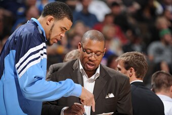 DENVER, CO - MARCH 21:  JaVale McGee #34 of the Denver Nuggets goes over a play with Assistand Coach Melvin Hunt during the game against the Detroit Pistons on March 21, 2012 at the Pepsi Center in Denver, Colorado. NOTE TO USER: User expressly acknowledg
