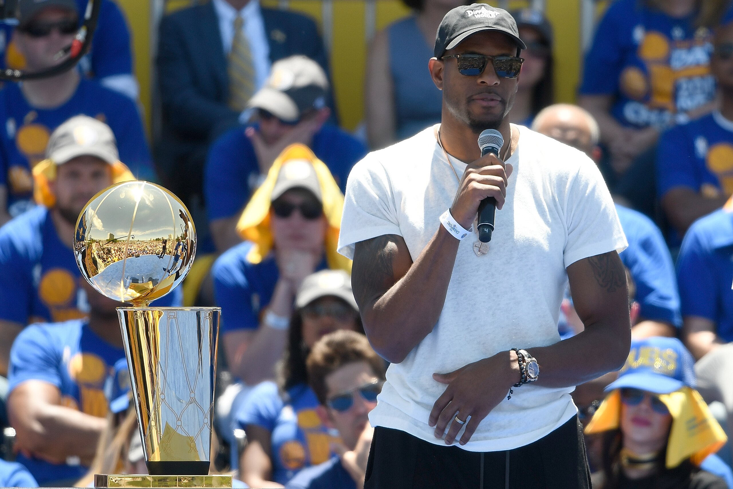 OAKLAND, CA - JUNE 15:  Andre Iguodala #9 of the Golden State Warriors talks to the fans while they celebrate the Warriors 2017 NBA Championship at The Henry J. Kaiser Convention Center during thier Victory Parade and Rally on June 15, 2017 in Oakland, Ca