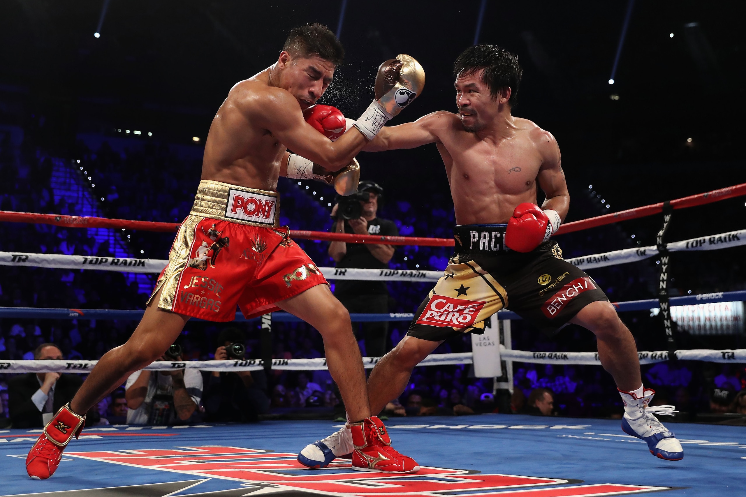 LAS VEGAS, NV - NOVEMBER 05: Manny Pacquiao (R) lands a right on Jessie Vargas during their WBO welterweight championship fight at the Thomas & Mack Center on November 5, 2016 in Las Vegas, Nevada. (Photo by Christian Petersen/Getty Images) LAS VEGAS, NV - NOVEMBER 05: Manny Pacquiao (R) lands a right on Jessie Vargas during their WBO welterweight championship fight at the Thomas & Mack Center on November 5, 2016 in Las Vegas, Nevada. (Photo by Christian Petersen/Getty Images)