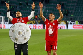 WOLFSBURG, GERMANY - APRIL 29:  (L-R)t Arturo Vidal and Rafinha of Bayern celebrate after winning the German Championship after winning 6-0 the Bundesliga match between VfL Wolfsburg and Bayern Muenchen at Volkswagen Arena on April 29, 2017 in Wolfsburg,