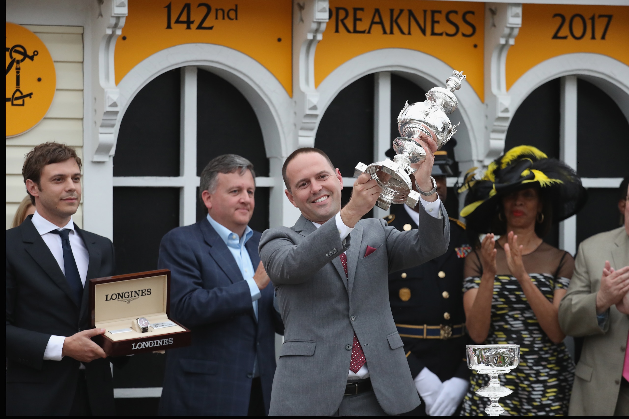 BALTIMORE, MD - MAY 20: Chad Brown trainer of Cloud Computing ridden by Javier Castellano #2 (not pictured) celebrates with the trophy in the winner's cirlce after the 142nd running of the Preakness Stakes at Pimlico Race Course on May 20, 2017 in Baltimo