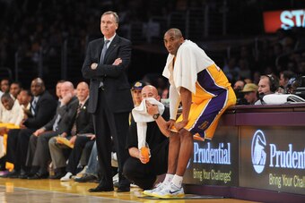 LOS ANGELES, CA - APRIL 5: Head Coach Mike D'Antoni of the Los Angeles Lakers and Kobe Bryant #24 look on from the sideline during a game against the Memphis Grizzlies at Staples Center on April 5, 2013 in Los Angeles, California. NOTE TO USER: User expre