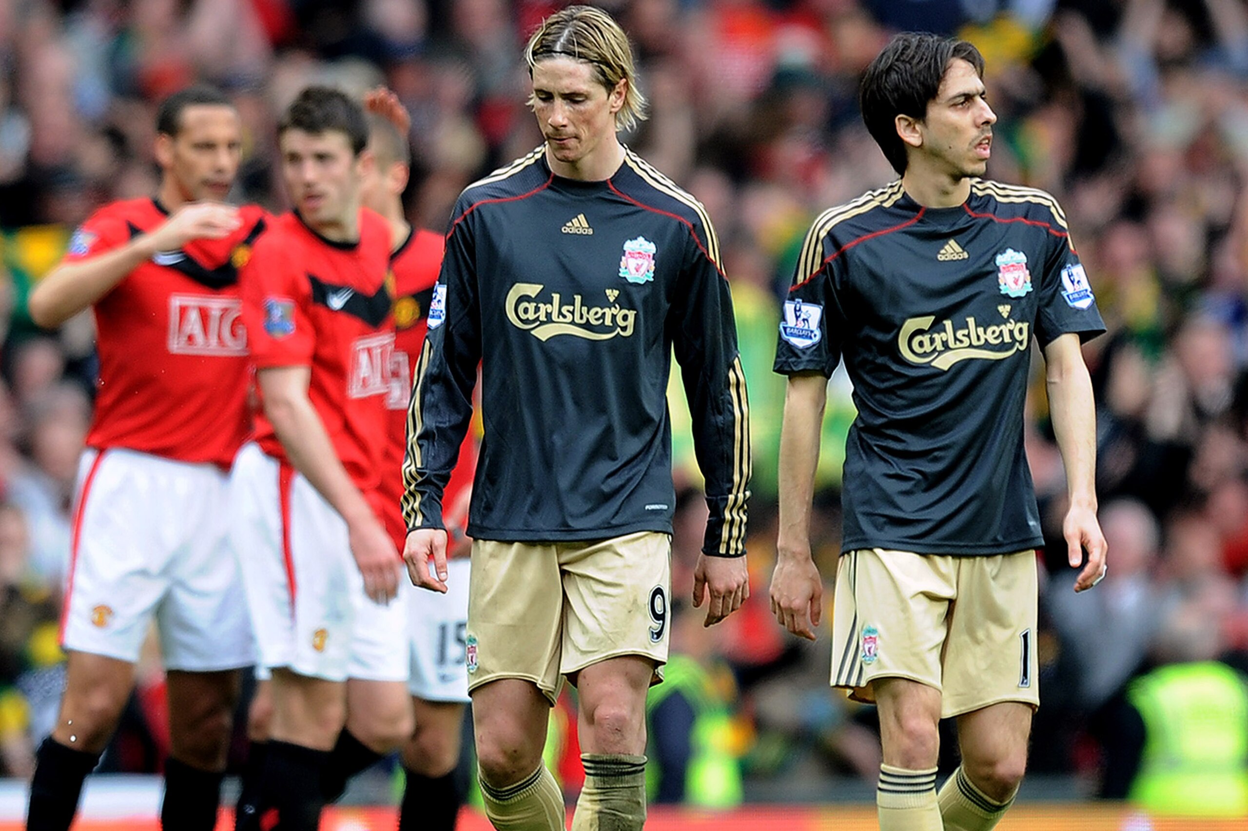 MANCHESTER, ENGLAND - MARCH 21: Fernando Torres (2nd R) and Yossi Benayoun of Liverpool look dejected after the Barclays Premier League match between Manchester United and Liverpool at Old Trafford on March 21, 2010 in Manchester, England.  (Photo by Mich