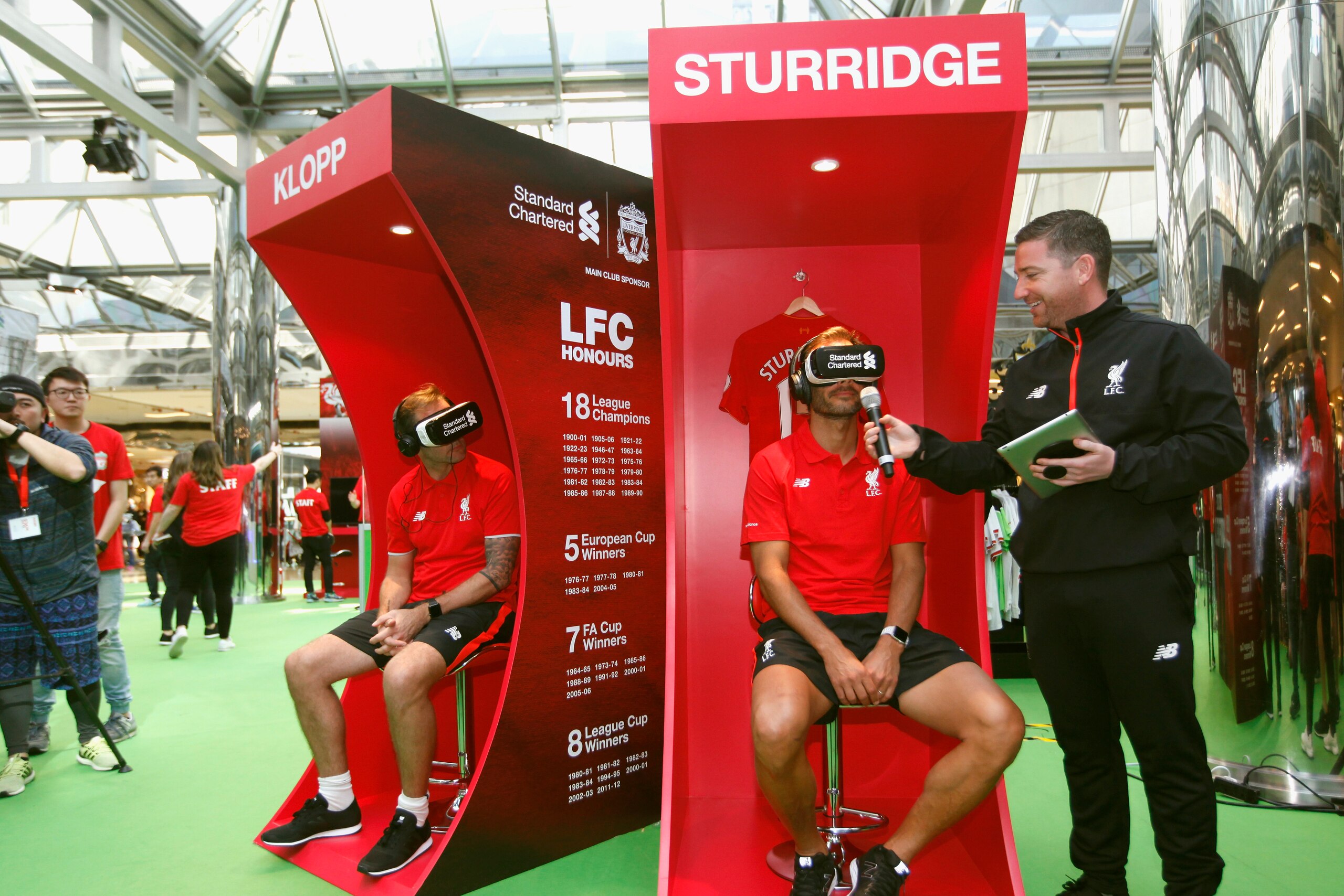 HONG KONG - MARCH 02: Patrik Berger (R) explains to the MC what he see with the 360¡ Virtual Reality goggles of the Anfield at LFC World on March 2, 2017 in Hong Kong, Hong Kong.  (Photo by On Man Kevin Lee/Getty Images)