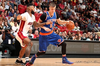 MIAMI, FL - MARCH 31: Kristaps Porzingis #6 of the New York Knicks handles the ball during the game against the Miami Heat on March 31, 2017 at AmericanAirlines Arena in Miami, Florida. NOTE TO USER: User expressly acknowledges and agrees that, by downloa