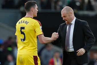 Burnley's English manager Sean Dyche (R) congratulates Burnley's English defender Michael Keane after the English Premier League football match between Crystal Palace and Burnley at Selhurst Park in south London on April 29, 2017.
Burnley won the game 2-0