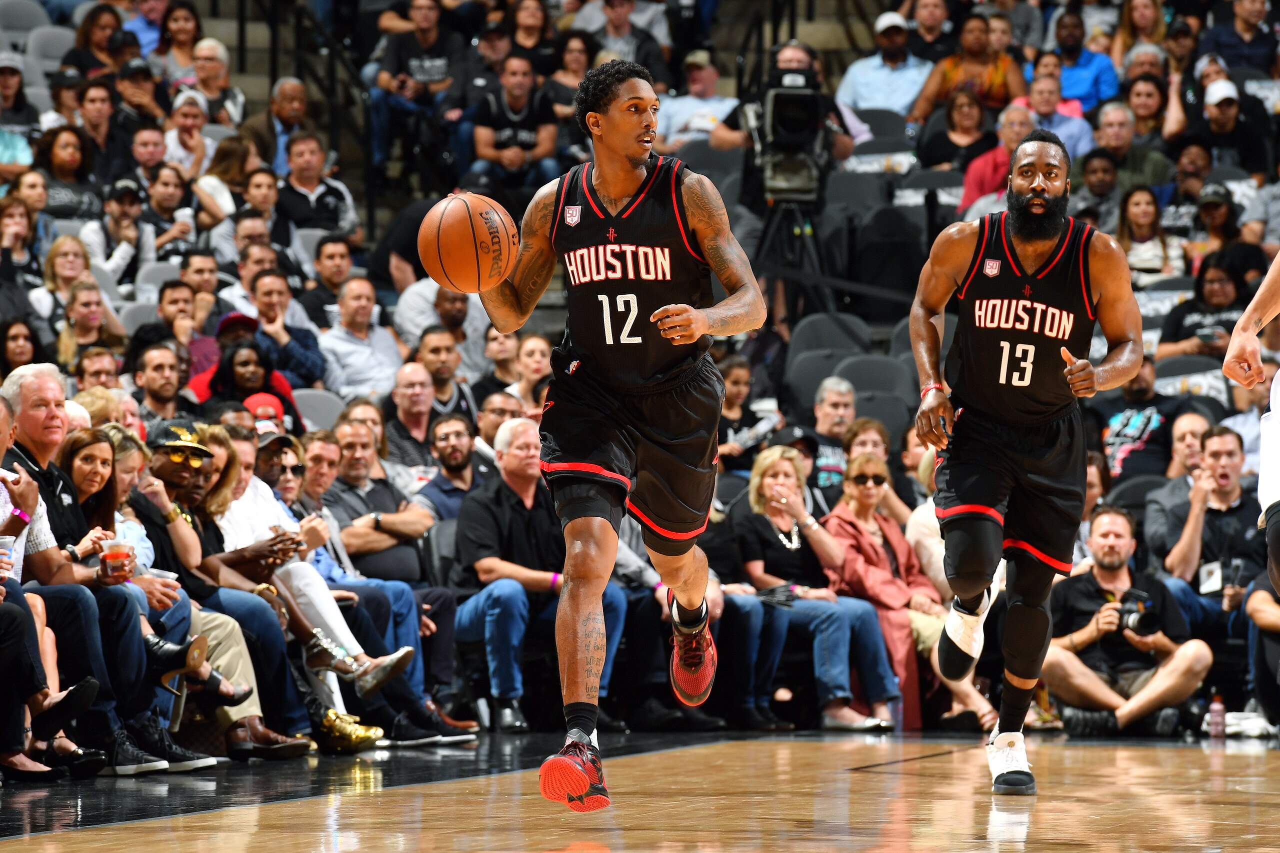 SAN ANTONIO, TX - MAY 9: Lou Williams #12 of the Houston Rockets brings the ball up court during the game against the San Antonio Spurs during Game Five of the Western Conference Semifinals of the 2017 NBA Playoffs on May 9, 2017 at the AT&T Center in San
