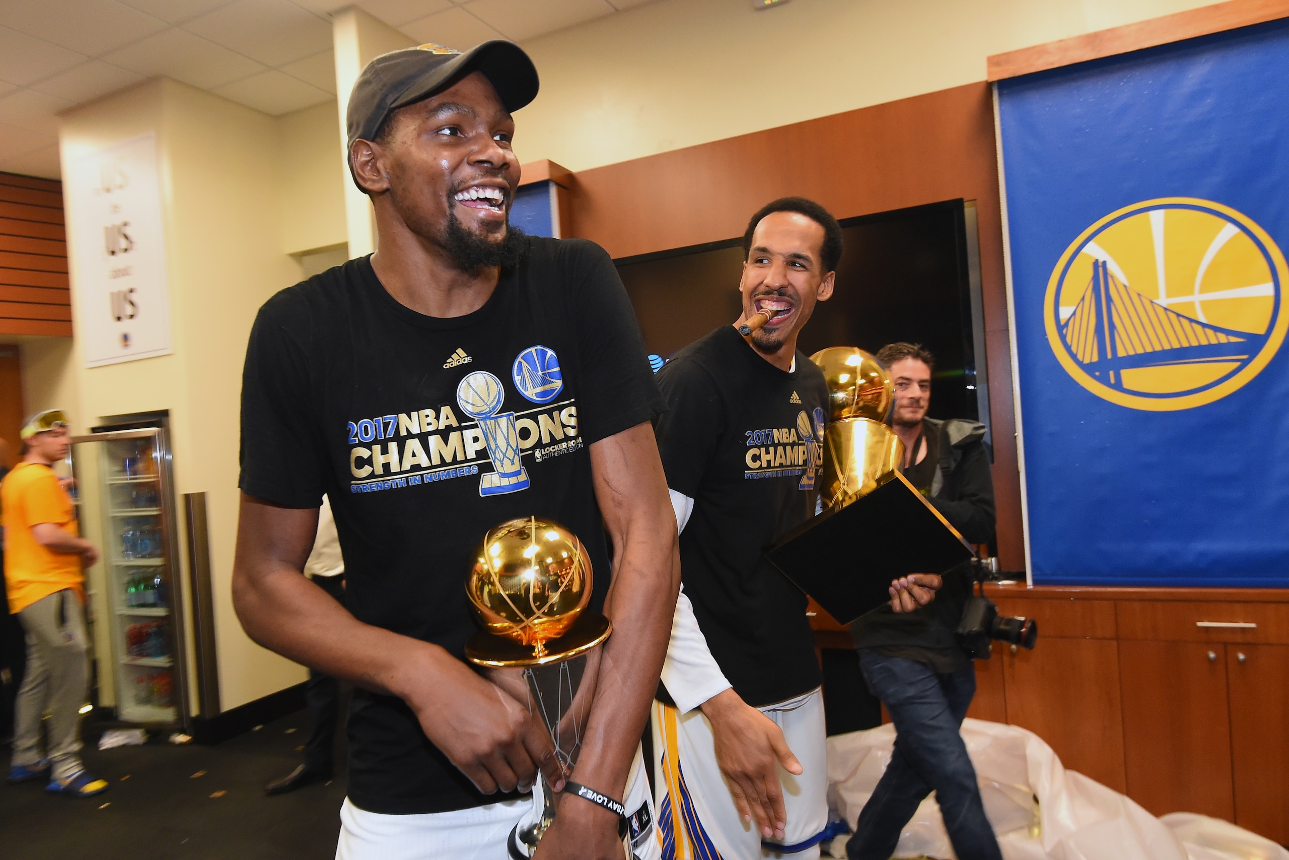 OAKLAND, CA - JUNE 12: Kevin Durant #35 and Shaun Livingston #34 of the Golden State Warriors celebrate in the locker room after winning the NBA Championshiop against the Cleveland Cavaliers in Game Five of the 2017 NBA Finals on June 12, 2017 at ORACLE OAKLAND, CA - JUNE 12: Kevin Durant #35 and Shaun Livingston #34 of the Golden State Warriors celebrate in the locker room after winning the NBA Championshiop against the Cleveland Cavaliers in Game Five of the 2017 NBA Finals on June 12, 2017 at ORACLE