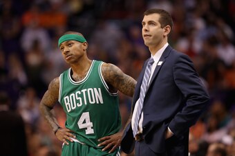 PHOENIX, AZ - MARCH 05:  Isaiah Thomas #4 of the Boston Celtics talks with head coach Brad Stevens during the second half of the NBA game against the Phoenix Suns at Talking Stick Resort Arena on March 5, 2017 in Phoenix, Arizona. The Suns defeated the Ce