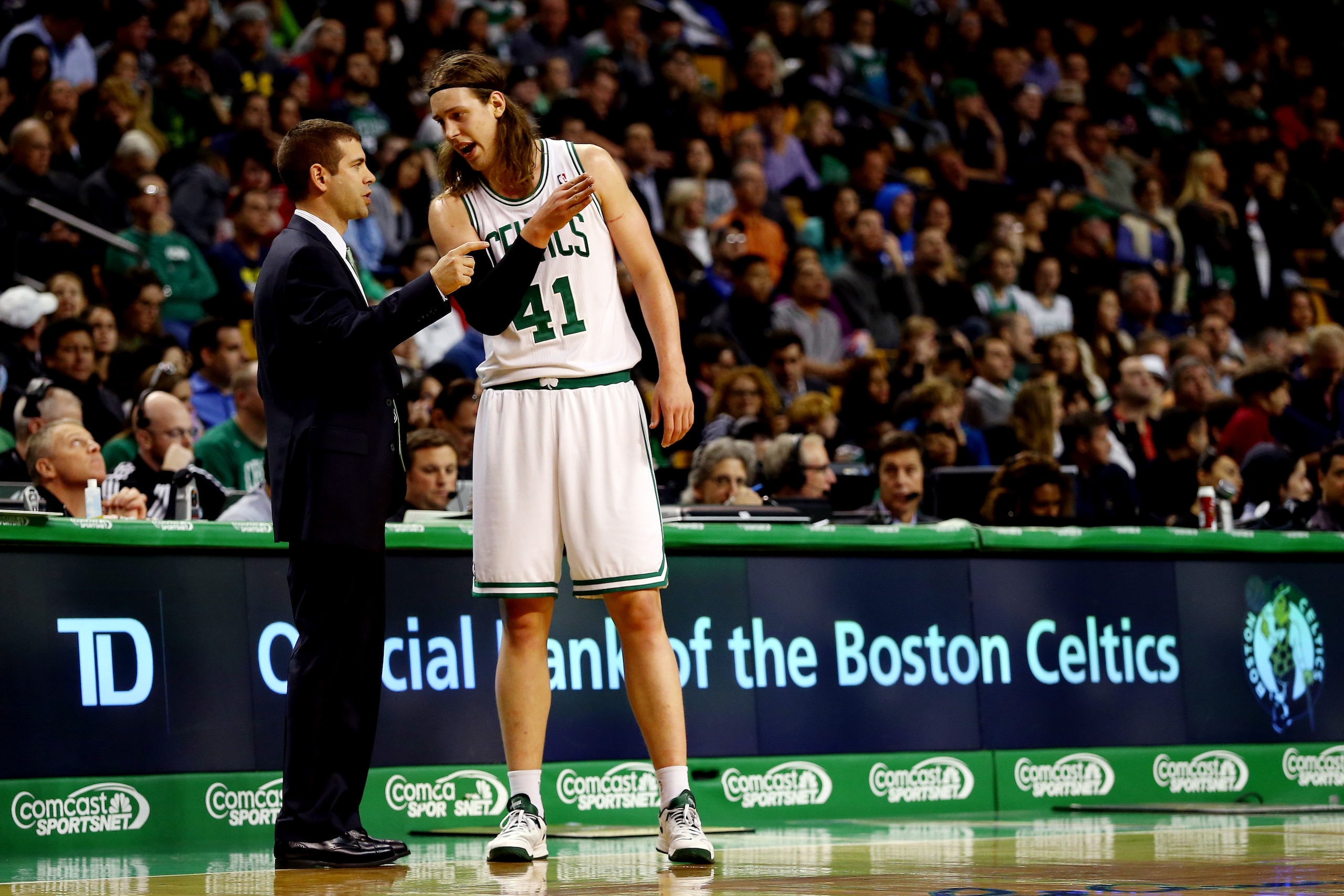 BOSTON, MA - NOVEMBER 11: Kelly Olynyk #41 of the Boston Celtics speaks with head coach Brad Stevens during a game against the Orlando Magic at the TD Garden on November 11, 2013 in Boston, Massachusetts. NOTE TO USER: User expressly acknowledges and agre