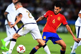 Spain's Dani Ceballos (r) and Italy's Davide Calabria vie for the ball during the UEFA U-21 European Championship football semi final match Spain v Italy in Krakow, Poland on June 27, 2017.  / AFP PHOTO / JANEK SKARZYNSKI        (Photo credit should read 