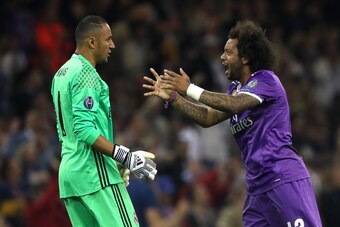 CARDIFF, WALES - JUNE 03:  Keylor Navas and Marcelo of Real Madrid celebrate during the UEFA Champions League Final between Juventus and Real Madrid at National Stadium of Wales on June 3, 2017 in Cardiff, Wales.  (Photo by Matthew Ashton - AMA/Getty Imag