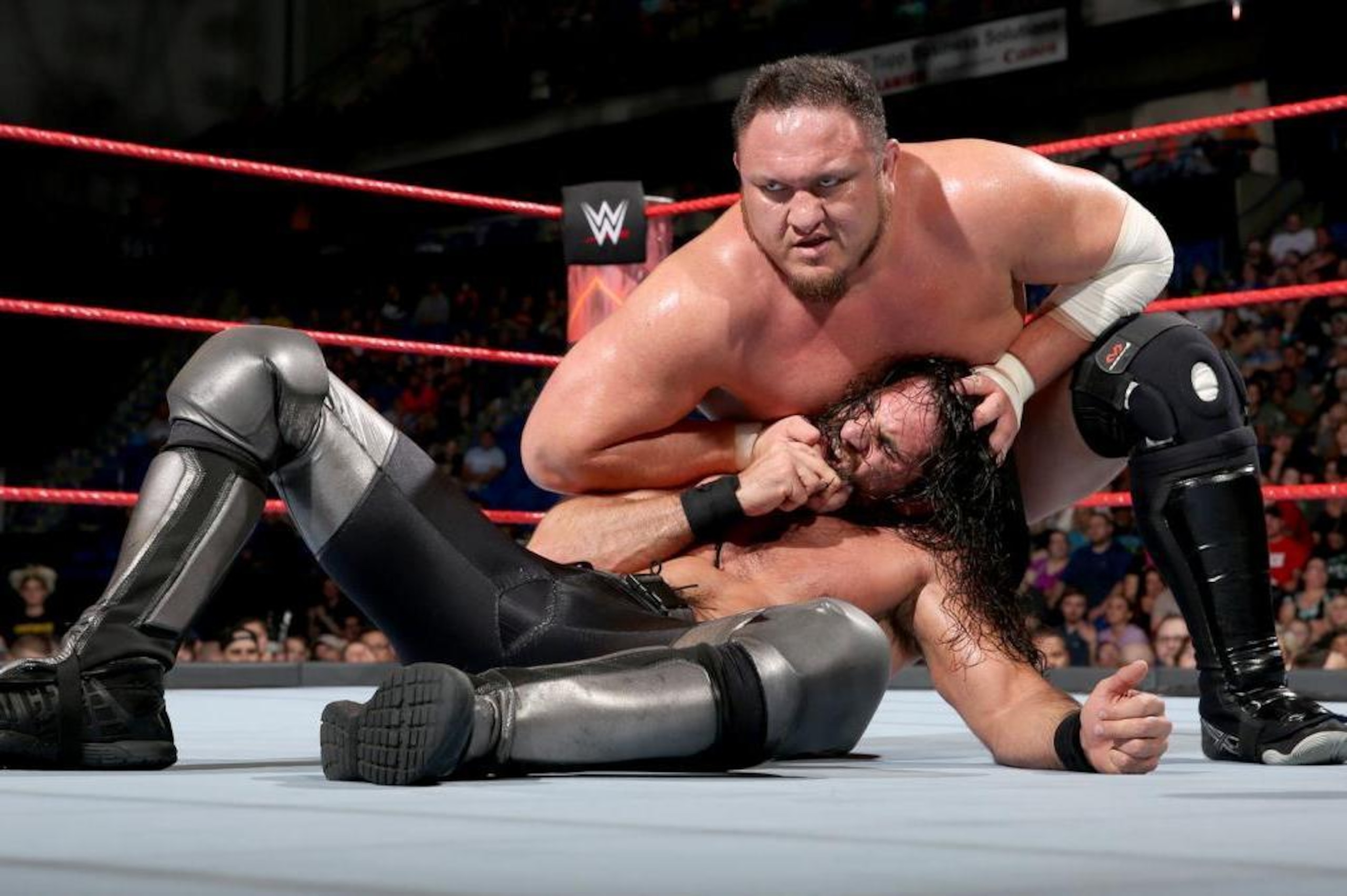 Samoa Joe grounds Seth Rollins on Raw.