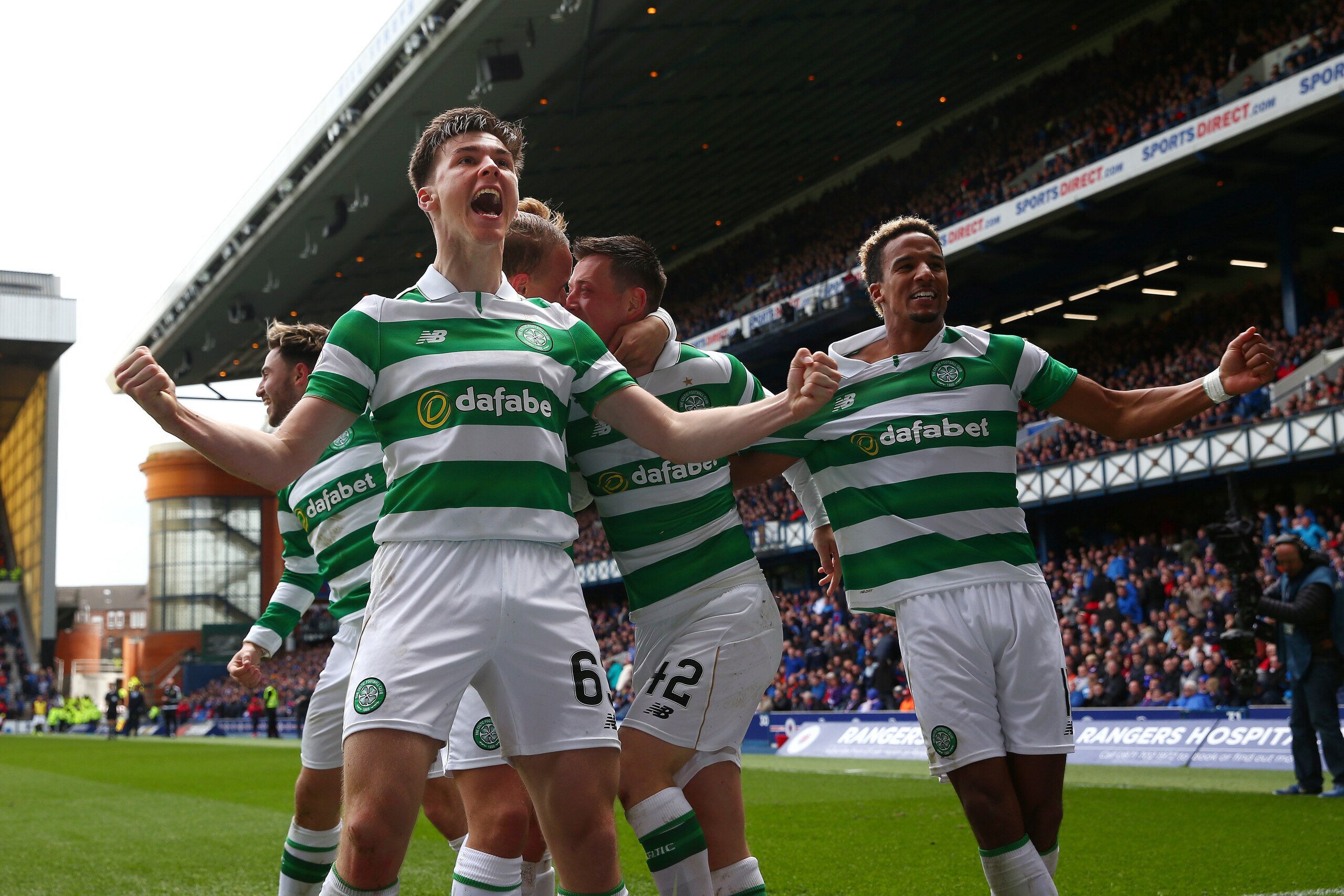 GLASGOW, SCOTLAND - APRIL 29: Kieran Tierney (L) and Scott Sinclair of Celtic celebrate their team's third goal scored by Callum McGregor during the Ladbrokes Scottish Premiership match between Rangers and Celtic at Ibrox Stadium on April 29, 2017 in Glas