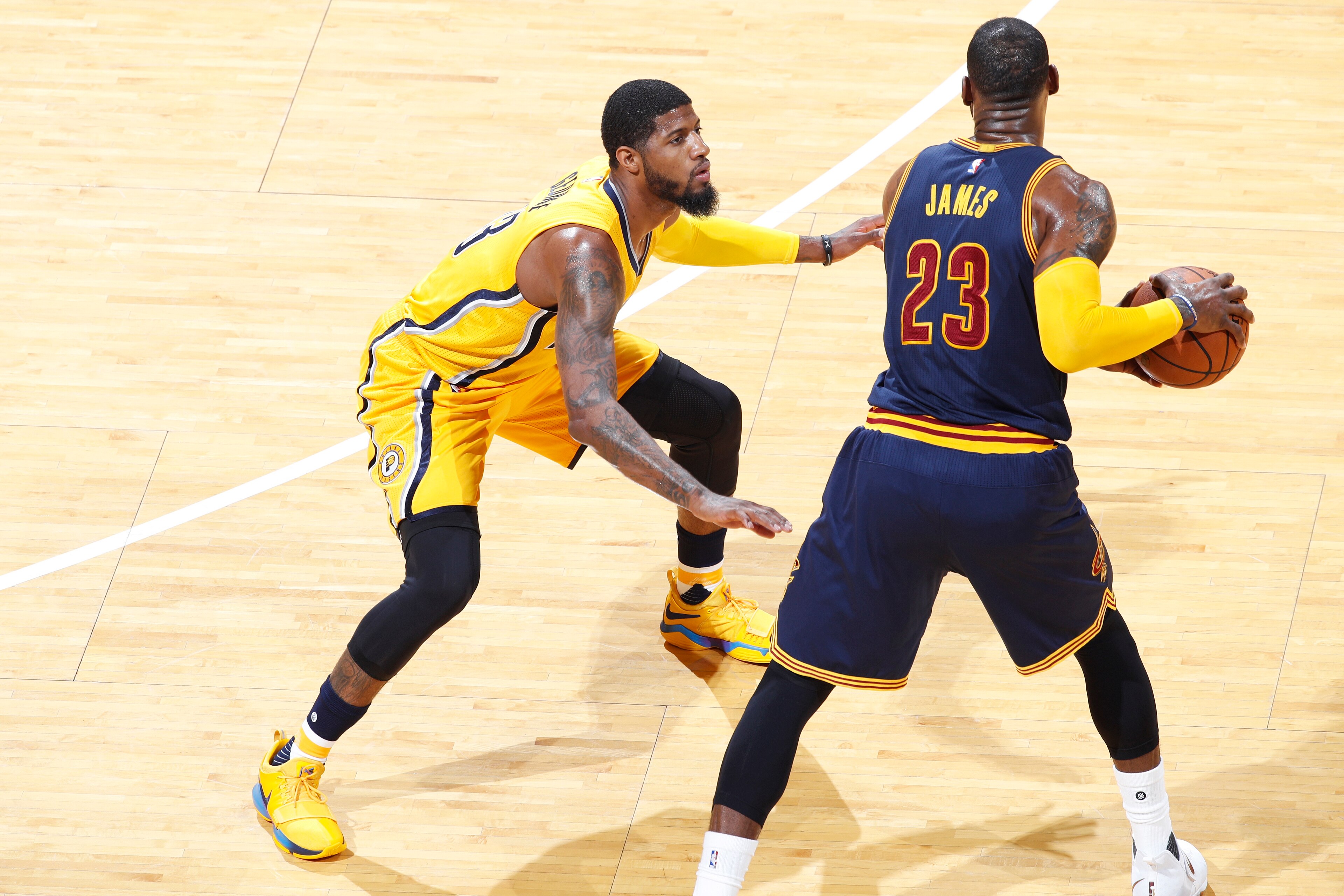 INDIANAPOLIS, IN - APRIL 20: Paul George #13 of the Indiana Pacers defends against LeBron James #23 of the Cleveland Cavaliers in game three of the Eastern Conference Quarterfinals during the 2017 NBA Playoffs at Bankers Life Fieldhouse on April 20, 2017 
