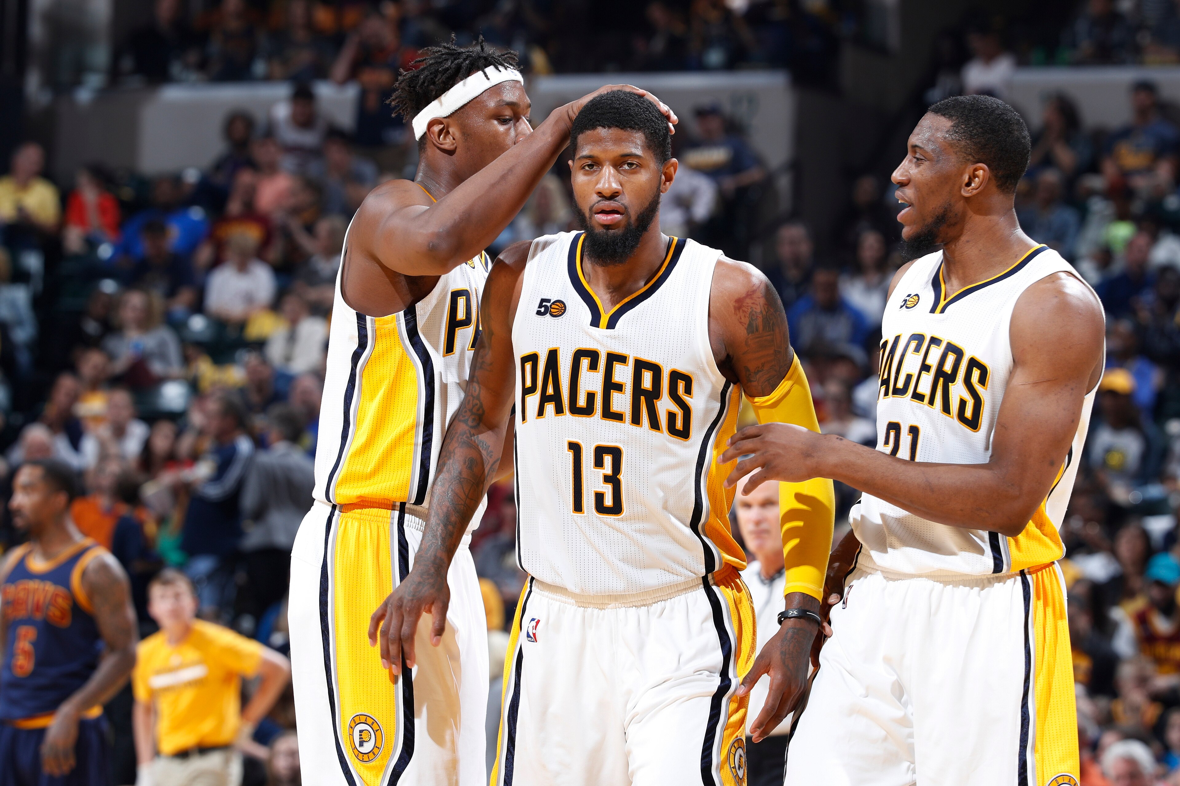 INDIANAPOLIS, IN - APRIL 23: Paul George #13 of the Indiana Pacers celebrates with Thaddeus Young #21 and Myles Turner #33 after scoring against the Cleveland Cavaliers in Game Four of the Eastern Conference Quarterfinals during the 2017 NBA Playoffs at B