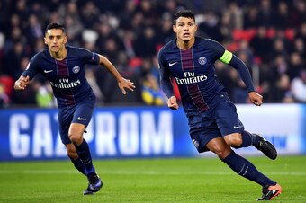 Paris Saint-Germain's Brazilian defenders Marquinhos (L) and Thiago Silva look at the ball during the UEFA Champions League Group A football match between Paris Saint-Germain and PCF Ludogorets Regraded at the Parc des Princes Stadium in Paris on December