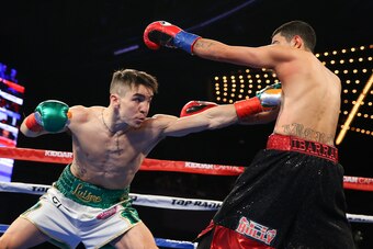 NEW YORK, NY - MARCH 17:  Michael Conlan (L) throws a left jab to the body of Tim Ibarra (R) during their super bantamweight bout at The Theater at Madison Square Garden on March 17, 2017 in New York City. (Photo by Ed Mulholland/Getty Images)
